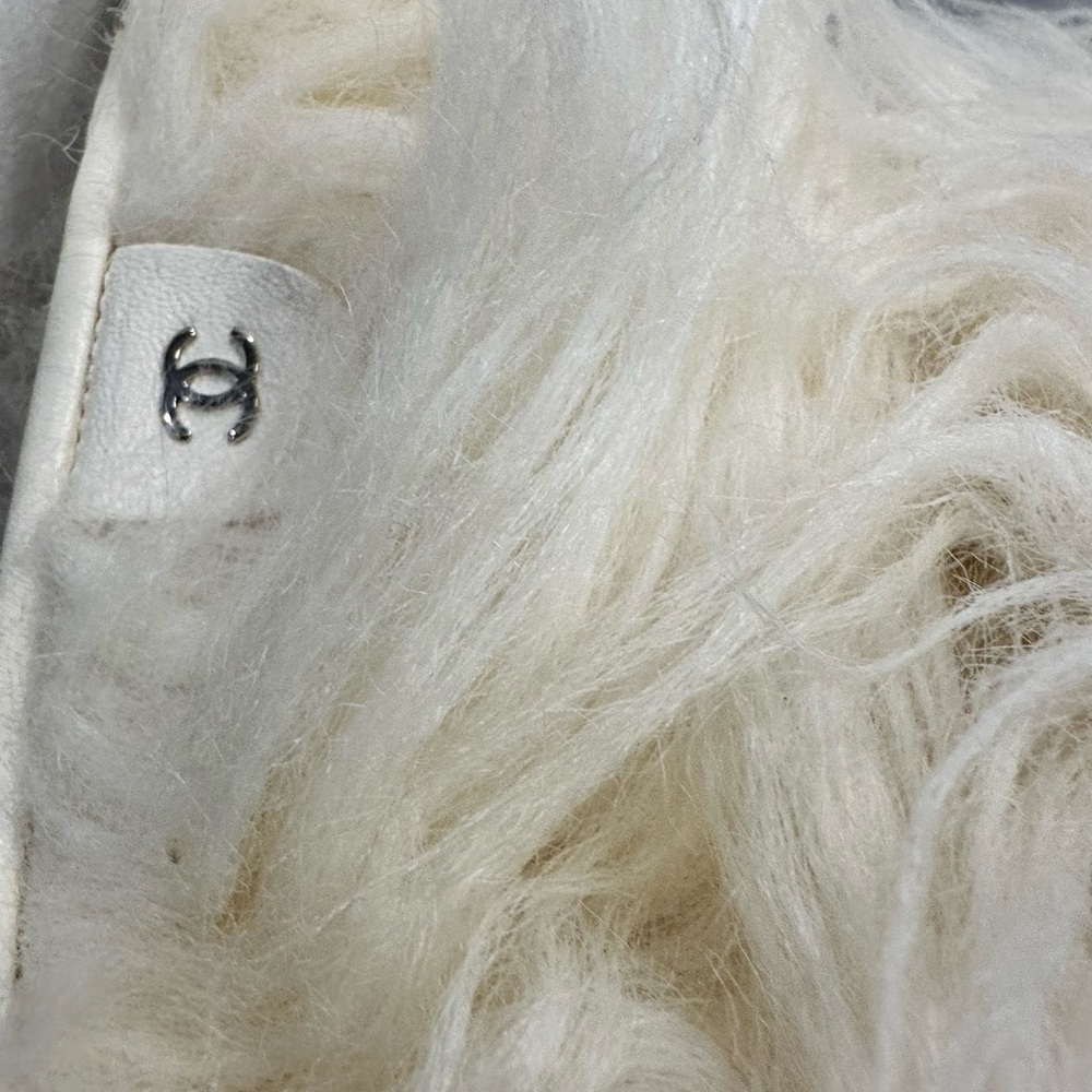 Chanel clear high heel fur boots.